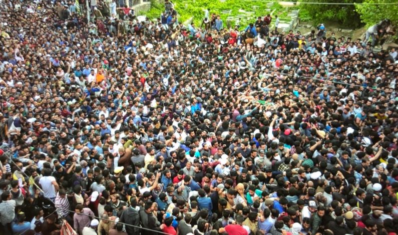 Tens of thousands of people marched with slain body of militant for final burial