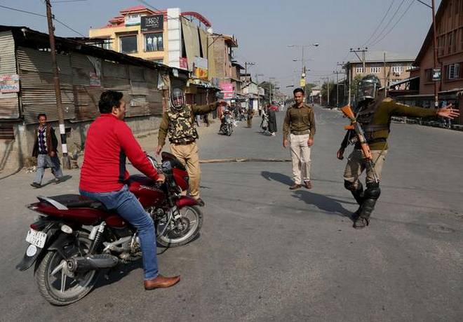 Police check points, vehicle frisking, ID checking returns to Kashmir’s capital Srinagar