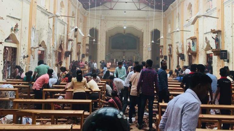 Sri Lankan police arrest 13 men in connection with serial blasts as death toll mounts to 290