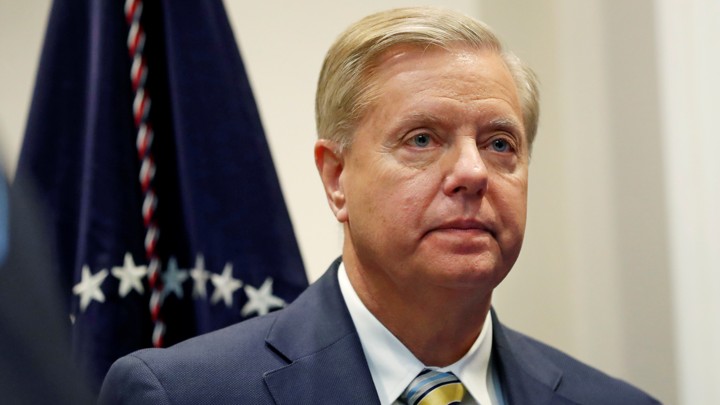 Sen. Lindsey Graham (R-SC) waits for U.S. President Donald Trump to enter the room to speak about the “First Step Act” in the Roosevelt Room at the White House in Washington, U.S.