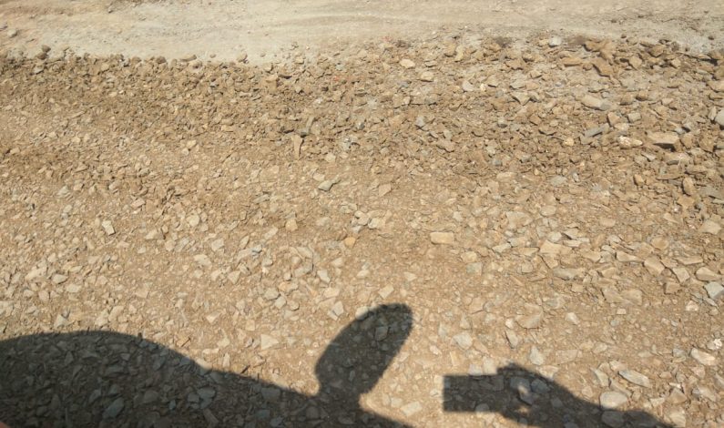 Widening of Bijbehara-Sirhama road: Construction company using muck in macademization, contractors remove sub-standard material Widening of Bijbehara-Sirhama road: Construction company using muck in macademization, contractors remove sub-standard material
