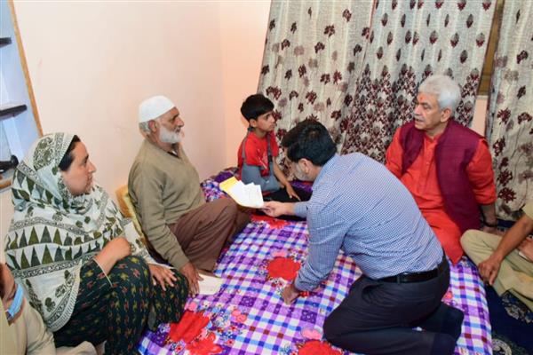 LG Sinha visits family of slain cop & home of slain TV artist